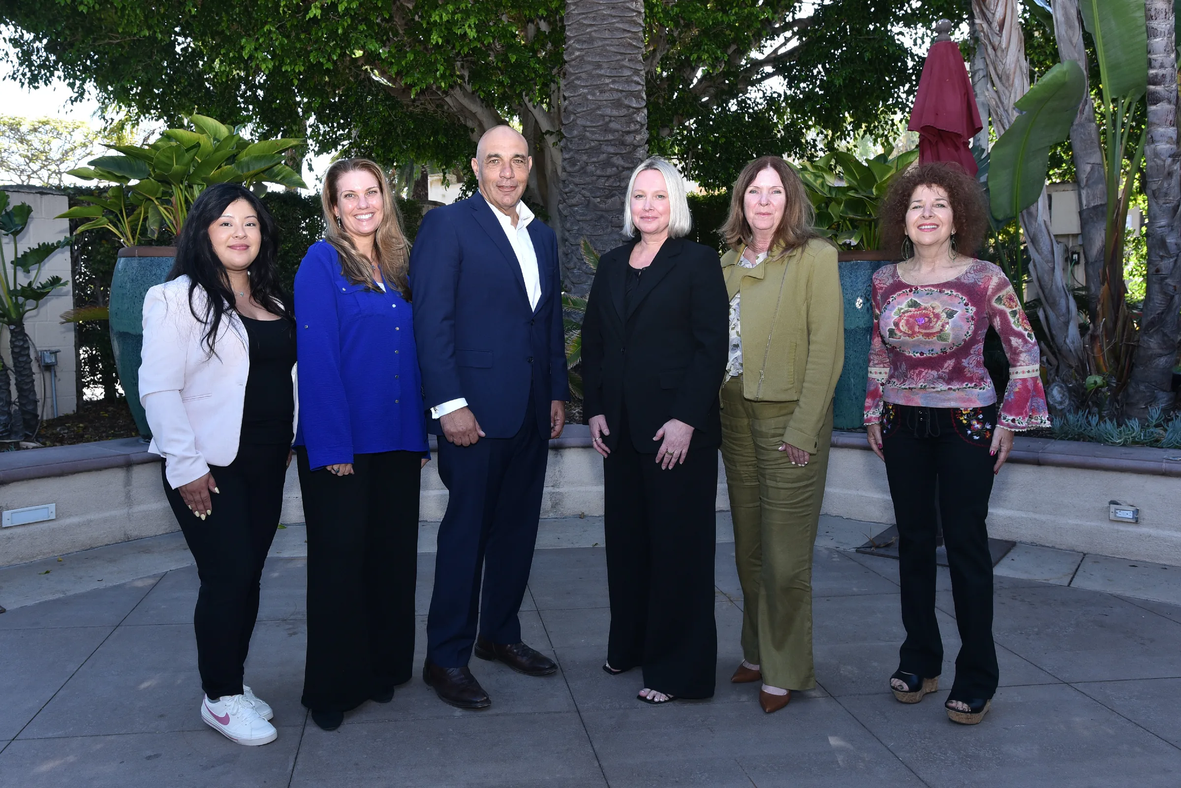 ARTISANCAP colleagues gathered at an outdoor table